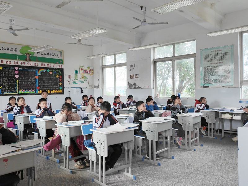 A full primary school class sitting at their desks during a lesson