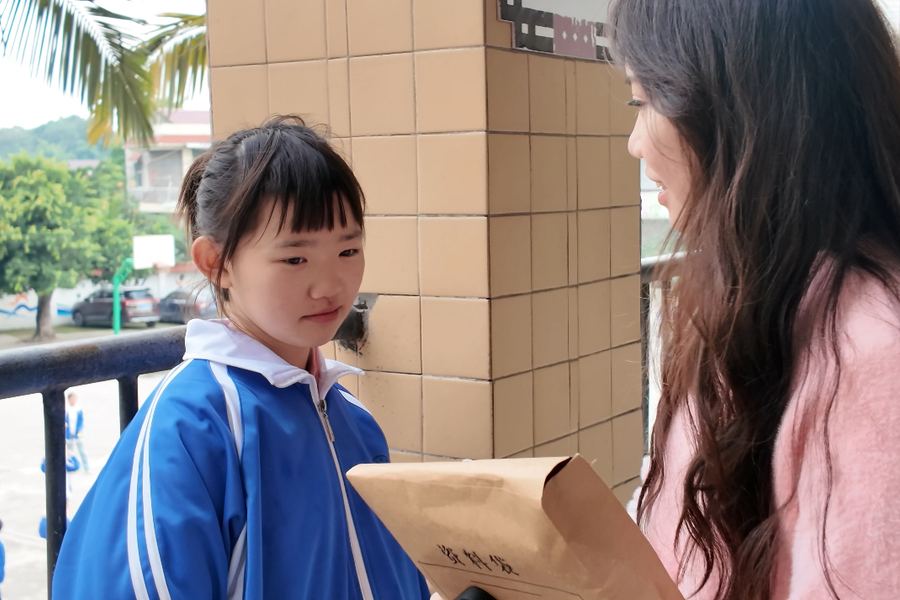 A pupil being interviewed about what they eat at school
